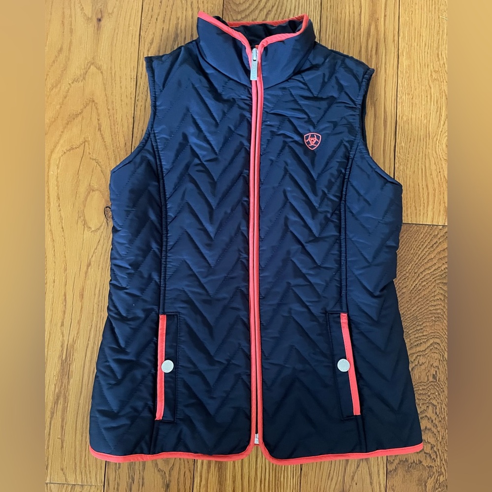 Ariat navy blue chevron quilt vest with raspberry piping and snap pockets.